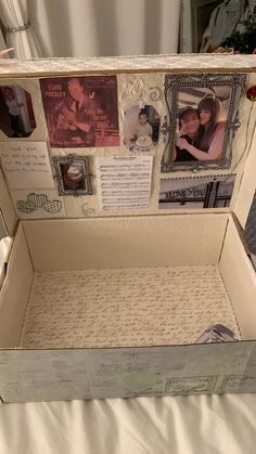 an open box with photos and pictures on it