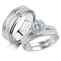 two white gold wedding rings with diamonds on each one and the other in their bands