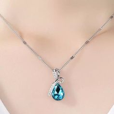 Sterling Silver Plated Crystal CZ  Water Drop Pendant Necklace  Material: Silver Plated,  Crystal & Cubic  Color: Blue Topaz  Pendant Size: Approx. 26mm(H)x14mm(W) Chain Length: Approx. 16"+2" Care for Plated Jewelry All Plated jewelries will tarnish.  To avoid tarnishing if possible, , limit exposure to water, perfume, Chemical or body cream etc. Store it in an air-tight zipped bag. Do not use silver or jewelry liquid cleaner, clean with a jewelry cloth. Remove the item before bathing, sleeping Blue Topaz Crystal, Topaz Crystal, Water Perfume, Blue Topaz Pendant, Topaz Pendant, Drop Pendant Necklace, Blue Plates, Zipped Bag, Plated Jewelry