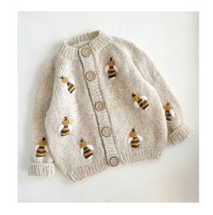 a white sweater with bees on it