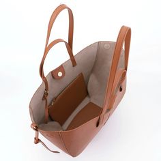 Elevate your everyday style with our Vintage Leather Women's Shoulder Bag, designed for the modern woman on the go. Crafted with a solid casual aesthetic, this spacious underarm tote effortlessly blends convenience with elegance. Its large capacity accommodates all your essentials while maintaining a sophisticated silhouette. Complete with an elegant purse, this versatile handbag exudes timeless charm and practicality. Upgrade your ensemble with this exquisite tote handbag, perfect for any occas Purse Design, Vintage Tote Bag, Vintage Shoulder Bag, Designer Wallets, Casual Tote, Tote Bag Leather, Branded Handbags, Shopper Bag, Bag For Women