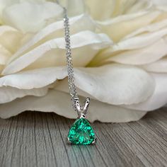 Sleek sellouts! 🤓. Order Emerald Trillion Shape Pendant Necklace For Ladies, 14k White Gold Dainty Layering Necklace, Triangle Shape May Birthstone Pendant. #6074 at $276.00 #AnniversaryGift #WeddingGift #LadiesGift #HolidayGift #TrillionNecklace #TriangleShape #BridalGift #MothersDay #BirthdayGift #EmeraldNecklace Emerald Jewelry With Trillion Brilliant Cut, Trillion Cut Brilliant Emerald Jewelry, Green Brilliant Cut Necklace For May Birthstone, Classic Green Trillion Cut Jewelry, Gift Emerald Diamond Necklace, Green Emerald Necklace With Diamond, Pear-shaped Emerald Necklace In White Gold, Gift Emerald Necklace With Diamonds, Gia Certified Green Necklace For Formal Occasions