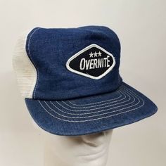 Vintage 1980s Overnight Trucking Company trucker hat, made in USA. Denim front with logo patch, mesh back.  Pre-owned. Several discolorations on mesh as shown in last photo. This hat will ship in a box to prevent damage during transit. Trucking Company, Hat Cap, In A Box, A Box, Patch Logo, Trucker Hat, Made In Usa, Mesh, ? Logo