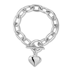 Embrace elegance with our Alana Puffy Heart Charm Bracelet, featuring a thick, rounded link chain secured by a toggle clasp with a charming 3D puffy heart. Specifications: Material: Recycled Brass Plating: Available in 14K Gold or Rhodium-Silver Protective Coating: Each chain is coated with a clear layer to prevent rapid wear and tarnishing. Charm Size: The solid puffy heart charm is 0.75 inches. Chain Dimensions: Links measure 20mm in length, 12mm in width, and 3mm in thickness. Available Lengt Elegant Metal Heart Bracelet With Toggle Clasp, Metal Heart Bracelet With Toggle Clasp, Elegant Heart Bracelet With Toggle Clasp For Valentine's Day, Elegant Valentine's Day Bracelets With Toggle Clasp, Silver Heart Bracelet With Toggle Clasp, Silver Heart-shaped Bracelet With Toggle Clasp, Puffy Heart Charms, 3d Heart, Puffy Heart