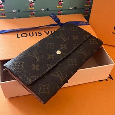 Authentic Louis Vuitton Long Monogram Wallet Made In France Code An0931 7.5” X 4” Zipper & Snap Work Well No Odors Cones With Box & Bow Luxury Brown Wallet For Daily Use, Luxury Brown Wallets For Daily Use, Brown Monogram Canvas Bag With Card Slots, Monogram Canvas Wallet With Original Box For Everyday Use, Luxury Wallet In Monogram Canvas, Elegant Brown Wallet With Original Box, Classic Wallet In Monogram Canvas With Original Box, Brown Monogram Canvas Wallet For Daily Use, Brown Monogram Canvas Bifold Wallet