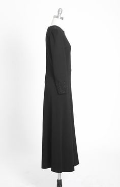 "Stunning one of a kind Vintage 1960s black knit wool maxi dress Hand beaded spiderweb motif on back and sleeves Back metal zipper Great vintage condition Original 1960s wool dress with vintage glass beaded designed and hand sewn by me M e a s u r e m e n t s: Size: fits like S M BUST: 18\" Waist: 15\" Hips: 22\" Total Length: 55\" Sleeves: 22 1/2\" Label: n/a Fabric: wool +All Measurements are taking while garment is lying flat+ + Jewelry, belts, and any other accessories are NOT included unles Formal Maxi-length Abaya For Fall, Embellished Maxi Dress For Formal Fall Events, Embellished Maxi Dress For Formal Fall Occasions, Embellished Fitted Long Abaya, Formal Fitted Long Abaya, Elegant Fitted Fall Abaya, Elegant Fitted Abaya For Fall, Formal Fitted Black Abaya, Elegant Evening Abaya For Fall