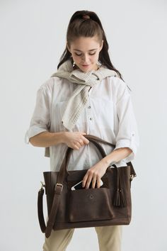 "Leather laptop bag, Graduation gift for daughter Personalized gift for women, Leather handbag, gift from mom, Leather crossbody ADD to cart MAKEUP BAG: https://etsy.me/2VTLIXI Excellent craftsmanship, amazing quality and the perfect size, make this laptop bag your favorite bag ever. These leather messengers are completely handmade with great care. Every knick, wrinkle and scratch is unique to the leather and adds to its character. You will absolutely love this bag! SIZES: ✦ EXTRA LARGE Size (XL Satchel Shoulder Bag As A Gift, Gift Satchel Shoulder Bag With Removable Pouch, Satchel Shoulder Bag With Removable Pouch As Gift, Brown Satchel With Removable Pouch As Gift, Leather Satchel As Gift, Brown Satchel With Adjustable Strap As Gift, Top Handle Satchel With Removable Pouch As Gift, Leather Bag With Laptop Sleeve For Gift, Leather Tote Laptop Bag Gift