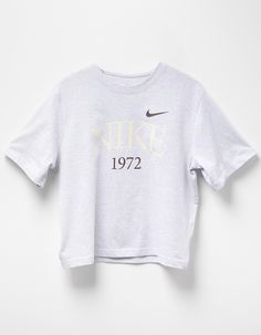 Nike Sportswear Classic Boxy Tee. 1972, The Year We Launched The First Nike Shoe, Serves As A Reminder Of The Past As You Reach Towards The Future. Heavyweight Cotton Gives You A Structured And Premium Feel, While The Boxy Fit And Dropped Shoulder Seams Create A Relaxed Look Without Feeling Too Big. Classic And Timeless—this Tee Does It All. 100% Cotton. Machine Wash. Imported. Nike Sporty T-shirt For Loungewear, Nike Retro T-shirt With Letter Print, Retro Nike T-shirt With Letter Print, Nike Sportswear Tops For Lounging, Nike Sportswear Tops For Loungewear, Sportswear Cropped T-shirt For Sports, Graphic Print Crew Neck Cropped T-shirt In Athleisure Style, Athleisure Cropped T-shirt With Graphic Print, Nike Sportswear Tops With Letter Print