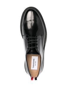 Black calf leather uniform lace-up loafers from THOM BROWNE featuring logo pull-tab at the heel, front lace-up fastening, polished finish, almond toe and flat leather sole. | Thom Browne Uniform Lace-Up Loafers Leather Logo, Thom Browne, Luxury Boutique, Tap Shoes, Calf Leather, Lace Front, Almond, Dance Shoes, Loafers