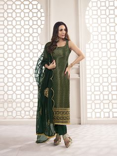 This great winter ensemble from Malaika Arora is perfect for your next special occasion. It includes a bottle green kurta set crafted from silk blend brocade, cotton and organza. Featuring Zari woven designs, a U-neck and calf length trousers, this set is sure to make a statement. It is dry clean only and designed specifically by the Bollywood Diva herself. TOP: Silk Blend(Brocade), TOP INNER: Cotton, BOTTOM: Cotton, DUPATTA: Organza, Dry Clean Stitched Salwar Designs, Cotton Suit Designs Sleeveless, Green Suit Designs Indian Style, Bottle Green Suits Women Indian, Brocade Kurta Set, Sleeveless Salwar Designs, Green Kurta Set Women, Winter Desi Outfits, Kurta Designs Women Sleeveless