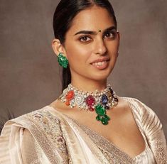 Isha ambani navratana Set. Base Material: Copper based Alloy Plating: Antique Gold Stone: ad stones, Imitation Stones Finish: Embellished In the Box: Necklace with Thread, Earring Pair, Extra Push Earrings  Type: Push Back Support: No Note - Actual product colors might vary a bit from what it appears in the photographs due to light conditions used during photography. We have taken precautions for the provided dimensions, but these should still be considered as an approximate. Actual dimensions m Ambani Jewellery, Ambani Family, Ratna Pathak, Ambani Wedding, Isha Ambani, Radhika Merchant, Rajasthani Bride, Brocade Lehenga, Nita Ambani