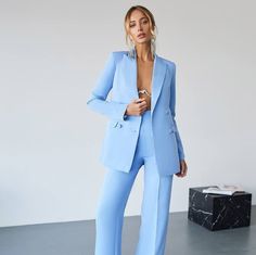 Introducing our Light Blue Women's Pants Suit Set, a sophisticated two-piece ensemble perfect for wedding guests and other formal occasions. Designed for the modern woman who values elegance and style, this suit set is available in both light blue and white. Fabric: Premium class crepe diagonal suit fabric for a luxurious and comfortable feel Sizes: XS, S, M, L, XL, XXL (XL and XXL sizes cost more) Dimensions: Jacket Back Length: 70 cm Sleeve Length: 62 cm Pants Side Length: 115 cm Step Seam Len Tailored Elegant Blazer For Gala, Elegant Tailored Blazer For Gala, Tailored Tuxedo Sets For Gala, Chic Fitted Blazer For Gala, Chic Fitted Blazer For Gala Events, Fitted Pantsuit For Spring Wedding, Elegant Blue Party Suit, Elegant Fitted Pants For Gala, Chic Fitted Sets For Gala