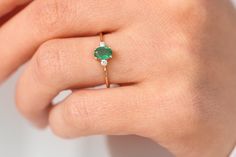 "Emerald Ring / Emerald Engagement Ring in 14k Gold / Oval Cut Natural 3 Stone Emerald Diamond Ring / May Birthstone / Promise Ring Features ✔Made to Order ✔Gold Kt: 14K (also available in 18K) ✔Available Gold Color: Rose Gold, Yellow Gold, White Gold ✔Oval Emerald: 1 pc 6x4MM ✔Round Diamond: 2 pcs 2.0 MM ✔Number of Stones: 3 ✔Emerald CTW: 0.70 ctw ✔Diamond CTW: 0.07 ctw ✔Ready to Ship in 7-10 Business Days If you have any additional questions about this ring, just hit the \"Ask a Question\" but Oval Three Stone Emerald Ring In Yellow Gold, Oval Emerald Three Stone Fine Jewelry Ring, Oval Three-stone Emerald Ring Fine Jewelry, Oval Three Stone Emerald Ring Fine Jewelry, Yellow Gold Three-stone Oval Birthstone Ring, Yellow Gold Three Stone Oval Birthstone Ring, Heirloom Oval Emerald Ring With Three Stones, 14k Gold Oval Emerald Ring With Three Stones, 14k Gold Three-stone Oval Ring