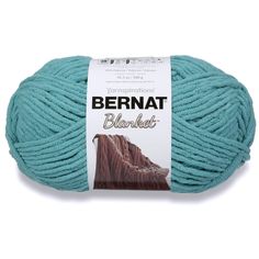 bernat blanket yarn ball in teal blue, on white background with brown and black logo