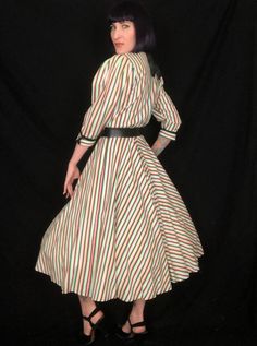 "Vintage 1940's Style Rainbow Black White Striped Avant Garde Fit and Flare Dress by \"Foxy Lady - San Francisco!\" Features: - an eye-catching black, white, and pastel rainbow striped print - edgy, dramatic pointed collar, with black cotton underside - pleating at tops of sleeves to create dramatic puff shoulders and sleeves - sleeves are a 3/4 length with upturned, split, winged cuffs with a decorative black button - bodice can be worn tight, or bloused, depending on your measurement - nipped Retro Full Skirt Vintage Dress, Retro Vintage Dress With Full Skirt For Events, Retro Full Skirt Vintage Dress For Events, Vintage Multicolor Dresses For Costume Party, Vintage Multicolor Dress For Costume Party, Vintage Multicolor Costume Party Dress, Lined Vintage Dress In Retro Style, Lined Retro Vintage Dress For Vintage Fashion, Lined Retro Vintage Dress For Vintage Events