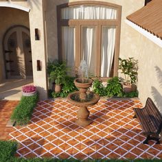 a fountain in front of a house with potted plants on the side and a wooden bench