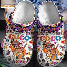 Personalized Coco Cartoon Colorful Clogs Shoes For Kids & Adults Fun Multicolor Non-slip Slippers, Fun Multicolor Round Toe Slippers, Casual Multicolor Clogs With Rubber Sole, Playful Multicolor Round Toe Slippers, Casual Multicolor Non-slip Slippers, Casual Multicolor Slippers With Rubber Sole, Fun White Clogs For Spring, Summer Multicolor Round Toe Clogs, Casual Multicolor Closed Toe Slippers