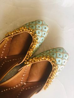 Beautiful Sea Green wedding juttis with gold embroidery and small bells. Club this jutti with your outfit to get the perfect bridal look. *Ethnic Shoes/Women Flats/Handmade Indian Designer Women Shoes or Slippers/Royal shoes/traditional style Women SPECIFICATIONS: *Upper/Panna -Fabric base embellished with sequence, thread work and small bells (ghungaroos) *Back/Adda - Fabric base embellished with sequence and thread work *Lining - Leather *Padding - Double Cushioning for extra comfort *Sole/Tal Wedding Flats With Mirror Work For Festivals, Traditional Festive Wedding Shoes, Traditional Wedding Shoes For Reception And Festivals, Flat Wedding Shoes For Receptions And Festivals, Flat Wedding Shoes For Reception, Traditional Zari Work Flats For Wedding, Traditional Gota Work Flats For Wedding, Traditional Wedding Shoes With Gota Work For Festive Season, Festive Wedding Shoes With Zari Work And Flat Heel