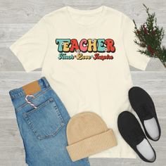 "If you're looking for a gift for your favorite teacher, or want to show your appreciation for all they do, check out our teacher shirt collection! Our shirts are designed with teachers in mind and are perfect for use during the back-to-school season or any other time of the year. Not only are our shirts stylish and functional, but they're also affordable. Shop our entire collection today and give the perfect gift to the person who means the world to you - your favorite teacher.  This classic unisex jersey short-sleeve tee fits like a well-loved favorite. Soft cotton and quality print make users fall in love with it over and over again. These t-shirts have ribbed knit collars to bolster shaping. The shoulders have taping for better fit over time. Dual side seams hold the garment's shape fo Teach Love Inspire, Best Teacher Ever, School Season, Favorite Teacher, Special Education Teacher, Teacher Favorite Things, Teacher Tshirts, Shirt Collection, Best Teacher