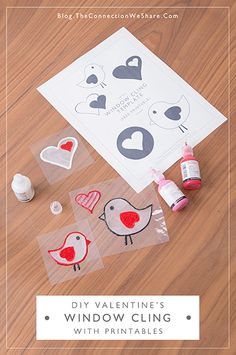 valentine's window cling with printables and craft supplies on the floor