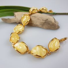 White Amber bracelet, gold plated Sterling Silver 925 bracelet with hallmarks. Adjustable resizable chain bracelet, gemstone bracelet. Will be just a stunning gif for her. Length : minimum 17- max 21 cm. Very elegant butterscotch gemstone bracelet. Weight 15.36 gr. Stone size 1.6 cm This item was made of natural Baltic Amber. All the amber used in my jewelry is collected in my home country Lithuania. I sell only genuine, real, not pressed, authentic, natural Baltic Amber. Item may have natural i Luxury Amber Jewelry For Wedding, Luxury Amber Heirloom Jewelry, Cheap Bohemian Amber Jewelry, Amber Jewelry Bracelets, Luxury Amber Statement Jewelry, Luxury Amber Jewelry With 8mm Beads, Elegant Gold Bracelets With Cabochon, Elegant Gold Bracelet With Cabochon, Elegant Natural Stones Beaded Bracelet