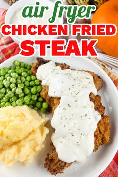 chicken fried steak with gravy, mashed potatoes and peas on a white plate