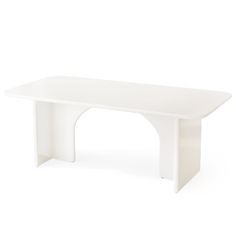 a white table sitting on top of a white floor