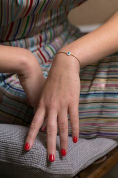 An adjustable cord bracelet featuring an evil eye charm and gold bamboo beading. Adjust this bracelet to fit your write at any size. The red cord is for good luck. The perfect bracelet to gift a friend or loved one for well wishes. #cordbracelet #evileye #eye #eyebracelet #adjustable #goldbeads #jewelrystore #jewelry #bracelet #bracelets #aesthetic #gifting #giftguide Bracelets Aesthetic, Adjustable Cord Bracelet, Cord Bracelet, Evil Eye Charm, Skincare Ingredients, Cord Bracelets, Bracelet Stack, Clean Beauty, Gold Beads