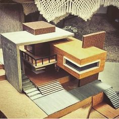 a model of a house made out of cardboard