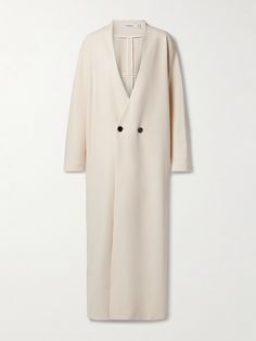 FFORME's 'Alva' coat is as timeless as it is versatile. With a collarless, V-neckline inspired by cardigans, it's been tailored in Italy from wool-blend crepe in a classic double-breasted silhouette. The longline cut makes it ideal for layering over maxi dresses and skirts. Elegant Beige Outerwear With Concealed Fastening, Spring V-neck Outerwear With Double Button Closure, Classic V-neck Outerwear With Hidden Buttons, Elegant Oversized Wool Coat, Elegant Oversized Outerwear With Concealed Placket, Fall V-neck Outerwear With Double Button Closure, Elegant Oversized Double-breasted Outerwear, Elegant V-neck Outerwear With Double Button Closure, Elegant V-neck Outerwear With Hidden Button Closure