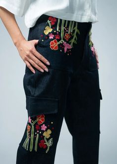 These jeans redefine casual elegance, featuring exquisite embroidery meticulously crafted onto the pockets, elevating your ensemble with a distinctive flair. Designed for the fashion-forward individual, these jeans seamlessly blend contemporary trends with timeless charm. The cargo pockets add a touch of utility, while the intricate embroidery ensures you stand out in any crowd. Step into fashion excellence with Pocket Thread Cargo Jeans, where every stitch tells a story of sophistication and st Women Cargo Pants, Into Fashion, Jeans Cargo, Scarf Poncho, Women Cargos, Intricate Embroidery, Cargo Pocket, Confident Woman, Suit Accessories