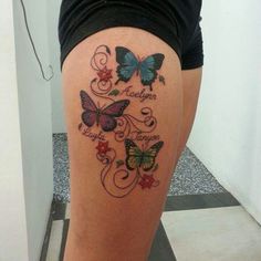 a woman's thigh with butterflies on it