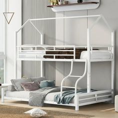 a white bunk bed sitting in a bedroom next to a wall mounted shelf and window