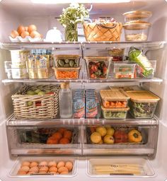 an open refrigerator filled with lots of different types of fruits and vegetables, including eggs