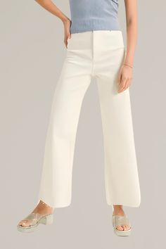 upgrade your casual wardrobe with these zara-dupe, cream wide-leg cut-off denim pants, a versatile blend of comfort and contemporary style. crafted from premium denim with stretch, these pants feature a flattering high-rise waist and a wide-leg silhouette that offers a relaxed, yet chic look. pairs effortlessly with both casual tees and dressier tops. finished with a cut-off hem for a modern edge, these pants are ideal for creating effortless day-to-night outfits. 98% cotton | 2% spandex back po Chic Cropped Wide Leg Pants For Spring, Versatile Straight Leg Culottes For Spring, Chic Beige Wide Leg Bottoms, Chic Wide Leg Cargo Pants, Chic Wide Leg Beige Bottoms, Elegant Wide Leg Spring Jeans, Elegant High Rise Jeans, Elegant White Cropped Leg Pants, Elegant Wide-leg Spring Jeans