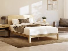 a bed sitting on top of a wooden floor next to a chair and table in a bedroom