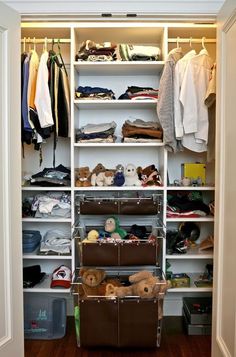 an open closet with clothes and other items