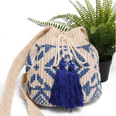 Tribal Straw Crossbody Bucket Bag 211-2 (1 unit) Adjustable Woven Shoulder Bag For Beach, Woven Festival Bags For Beach Season, Woven Bags For Beach Festival Season, Bohemian Beach Bag With Adjustable Strap For Travel, Woven Bags For Festival And Beach Season, Woven Vacation Backpack, Adjustable Woven Shoulder Bag For Travel, Bohemian Beach Bucket Bag, Blue Backpack For Vacation