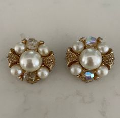 "Vintage clip on earrings from the 1950s perfect for a special occasion or wedding. Cluster of faux pearls and crystals encased in gold metal. 1\" diameter" Vintage Gold Pearl Clip-on Earrings, Seashell Bracelet, Vintage Clip On Earrings, Snake Bracelet, Pearl Crystal, Vintage Clip, Pearl Grey, Vintage Wool, The 1950s