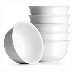 a stack of white bowls sitting next to each other