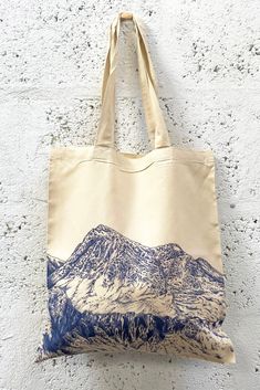 Tote bag itself  41cmx 37cm natural soft feel tote bag with print printed on one side  Artwork:  My 'Transition, the place I call home' collection . The collection is based around my move from London to the Scottish Highlands and the significant positive impact it has had on my mental heath and wellbeing. I wanted to create a collection to express this and how calming the mountains can be. I hope this calm and element of peace comes across in this collection.  Postage: Dispatch time is 1-3 worki Artistic Tote Bag For Everyday, Artistic Everyday Tote Bag, Artistic Large Capacity Tote Bag, Travel Tote Bag With Graphic Print, Graphic Print Tote Bag For Travel, Graphic Print Tote Shoulder Bag For Travel, Eco-friendly Natural Tote Bag, Eco-friendly Travel Bags With Graphic Print, Blue Bags With Graphic Print For Daily Use