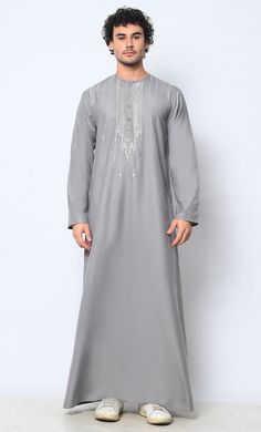 Ornate Reverence: Islamic Embroidered Men's Grey Thobe with Pockets - EastEssence.com Luxury Men's Dabka Thobe, Elegant Gray Kurta For Eid, Formal Embroidered Long Sleeve Thobe, Traditional Gray Kurta For Wedding, Festive Traditional Wear With Tonal Embroidery For Eid, Eid Festive Traditional Wear With Tonal Embroidery, Traditional Gray Wear For Eid, Gray Traditional Wear For Eid, Traditional Gray Kurta For Eid