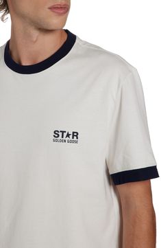 The Italian label's signature broken-star logo winks at the chest of this vintage-inspired ringer T-shirt cut from comfortable cotton. Crewneck Short sleeves 100% cotton Machine wash, dry flat Made in Italy Designer Clothing Graphic Tee Cotton T-shirt With Star Patch, Cotton Crew Neck T-shirt With Star Patch, Cotton Graphic Tee With Star Patch, Cotton T-shirt With Star Patch, Cotton T-shirt With Star Patch And Short Sleeves, Retro Cotton Crew Neck T-shirt, Cotton Crew Neck Top With Star Patch, T Shirt Cut, Star Logo