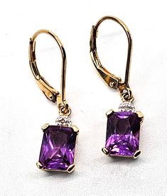 Pink Sapphire faceted open work gold over sterling silver vermeil earrings. Good used condition with little to no signs of normal vintage wear. Prong set emerald cut pink sapphire earrings. Stamped on the back 925 with a wave hallmark and China. Acid tests positive for sterling silver. Gemstone tested with Presidium II gemstone tester. Glows under UV light. Earrings measure 1 inch tall and 1/4 of an inch wide. Elegant Octagon 14k Gold Earrings, Elegant Octagon Gemstone Earrings, Rectangular Faceted 14k Gold Jewelry, Octagon 14k Gold Fine Jewelry Earrings, 14k Gold Faceted Rectangular Jewelry, 14k Gold Octagon Fine Jewelry Earrings, Rectangular Prong Set Earrings As Gift, Classic Gold Emerald Cut Earrings, Classic Emerald Cut Gold Earrings