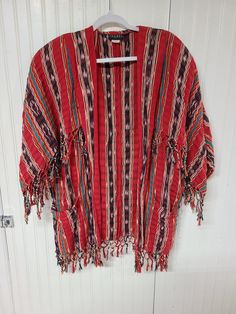 "This is in good condition! It measures 35\" long x 24 1/4\" shoulder to shoulder wide, with 12\" l sleeves, that are 7 5/8\" w. Please feel free to ask me any questions. Thanks." Red Folk Style Spring Outerwear, Multicolor Cotton Outerwear For Summer, Traditional Oversized Outerwear For Spring, Bohemian Open Front Cotton Outerwear, Vintage Long Sleeve Kimono For Festival, Summer Hippie Long Sleeve Outerwear, Hippie Long Sleeve Cotton Kimono, Hippie Style Long Sleeve Cotton Kimono, Hippie Style Cotton Long Sleeve Kimono