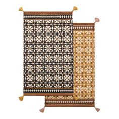 two rugs with different patterns and tassels