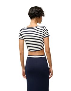 Discover the casual and elegant Guard Top. This fitted crop top features a bold striped pattern. It's the perfect addition to your wardrobe. Pair with the Karina Skirt! Chic Fitted Striped Tops, Chic Fitted Vertical Stripes Tops, Chic Fitted Top With Vertical Stripes, Chic Fitted Tops With Vertical Stripes, Chic Fitted Top With Contrast Stripes, Chic Fitted Tops With Contrast Stripes, Striped Short Sleeve Crop Top For Spring, Spring Striped Short Sleeve Crop Top, Striped Fitted Cropped Top