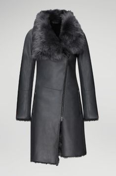 Women's Fur Shearling Leather Coat In Matte Black Experience the luxury of our women's fur shearling leather coat in matte black. Crafted from genuine sheepskin leather with a semi-aniline finish, this coat features a warm faux shearling inner shell. The design includes a zipper closure, a plush fur collar, and open hem cuffs for a sophisticated look. Practicality meets elegance with one inside pocket and two side zip pockets. This matte black coat offers a perfect blend of style and comfort for Leather Shorts Women, Short Leather Skirts, Black Experience, Leather Jumpsuit, Shearling Vest, Studded Jacket, Sheepskin Jacket, Distressed Jacket, Western Jacket