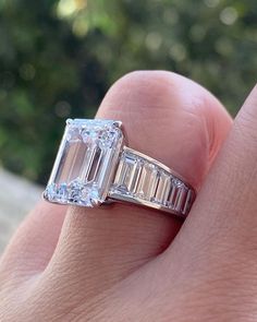 6.0 CT Emerald Cut Moissanite Engagement Ring, 14K Yellow Gold Ring, Solitaire Wedding Ring, Promise Ring, Gift For Her, Daily Wear Ring Details: * Center Stone: 💎 6 CT Emerald Cut Moissanite, known for its exceptional clarity and brilliance * Color: 🌟Colourless  * Clarity: 🌈 VVS1 clarity for unparalleled quality * Carat & Dimensions: Carat, measuring * Band: Available in 10K, 14K, 18K Solid Gold or Platinum, with a 2mm width and 1.7mm thickness Customization Options: We believe that jewelry Moissanite Baguette Cut Diamond Promise Ring, Baguette Cut Moissanite Diamond Promise Ring, Moissanite Solitaire Baguette Cut Wedding Ring, Brilliant Cut Moissanite Emerald Ring For Promise, Baguette Cut Moissanite Promise Ring, Baguette Cut Moissanite For Promise Rings, Moissanite Emerald Ring With Vvs Clarity For Promise, Silver Emerald Ring With Baguette Cut Moissanite, Silver Moissanite Emerald Ring With Baguette Cut