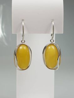 Big white Amber earrings - 1 pair.. Natural butterscotch Baltic Amber. Each pair can be slightly difderent colour due to amber is being natural. Handmade earrings. Sterling silver 925, with stamps. Earrings length about 4 cm. A matching pendant is also available. Modern Cabochon Earrings For Gifts, Modern Cabochon Earrings Gift, Amber Cabochon Earrings For Gifts, Amber Cabochon Earrings Gift, Cabochon Amber Earrings For Gift, Classic Yellow Earrings As Gift, Classic Yellow Earrings For Gift, Elegant Yellow Baltic Amber Earrings, Baltic Amber Earrings As A Gift